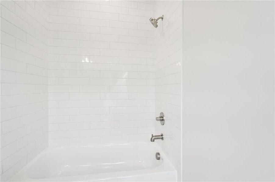 Bathroom featuring shower / bathtub combination
