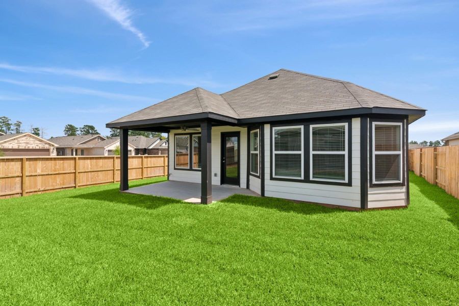 Front exterior of a new home in Moran Ranch, Willis, TX, highlighting curb appeal (Image 8). Front exterior of a new home in Moran Ranch, Willis, TX, highlighting curb appeal (Image 8).