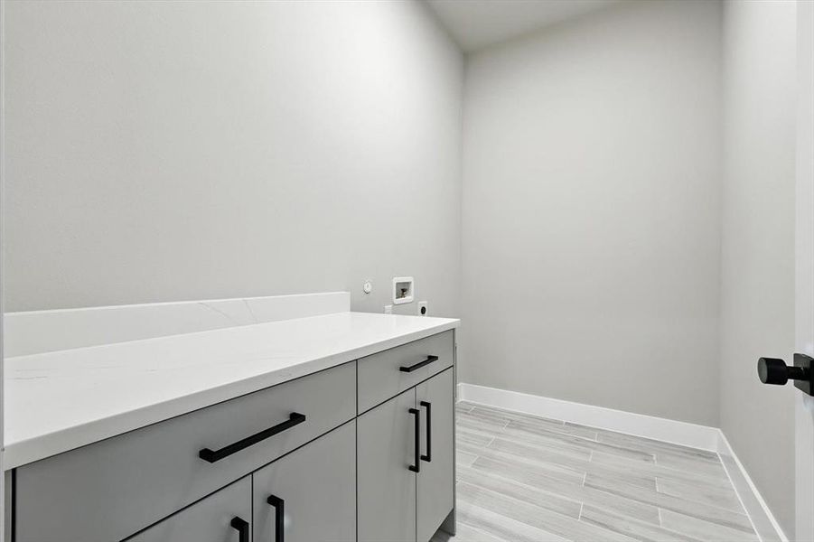 Bathroom featuring vanity and wood finished floors Bathroom featuring vanity and wood finished floors
