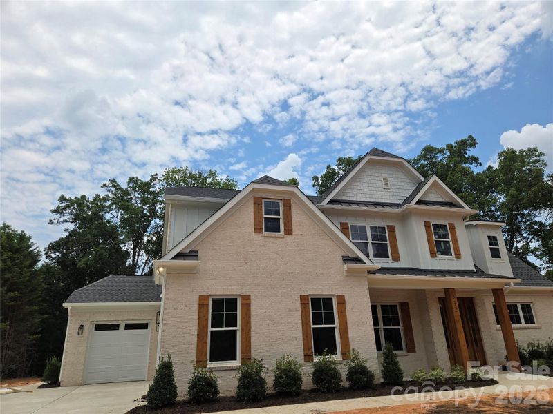 Front exterior of a new home in , Fort Mill, SC, highlighting curb appeal (Image 1). Front exterior of a new home in , Fort Mill, SC, highlighting curb appeal (Image 1).