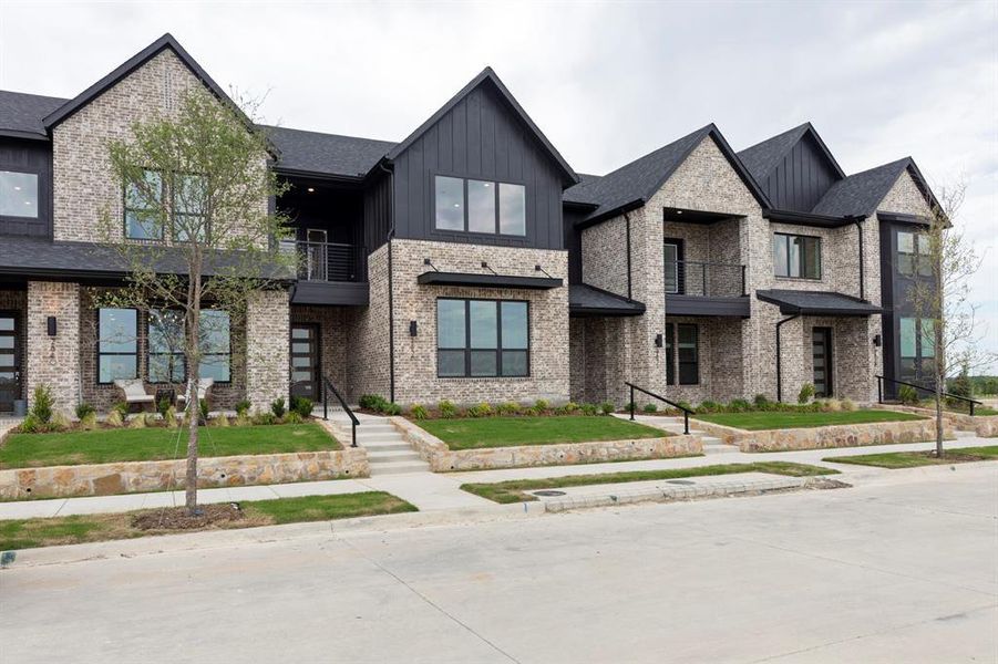 Front exterior of a new home in Ridgeline Towns, McKinney, TX, highlighting curb appeal (Image 25). Front exterior of a new home in Ridgeline Towns, McKinney, TX, highlighting curb appeal (Image 25).
