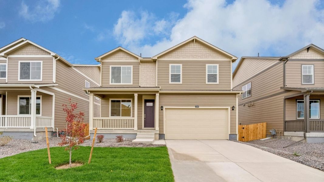 Front exterior of a new home in Vista Meadows, Fort Lupton, CO, highlighting curb appeal (Image 1). Front exterior of a new home in Vista Meadows, Fort Lupton, CO, highlighting curb appeal (Image 1).