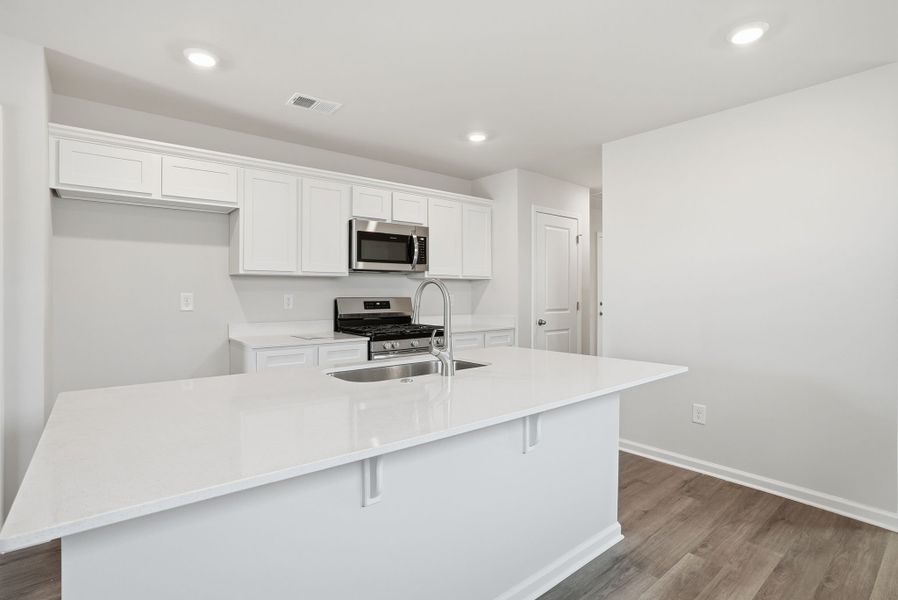 Representative furnished interior of a home built from the Juniper A by McGuinn Homes in Forts Ridge, Pelion (Image 6).