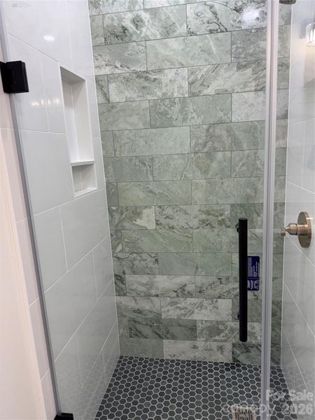 Bathroom 4 with custom shower tile and glass door