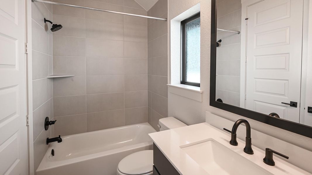 Bathroom featuring shower / tub combination and vanity Bathroom featuring shower / tub combination and vanity