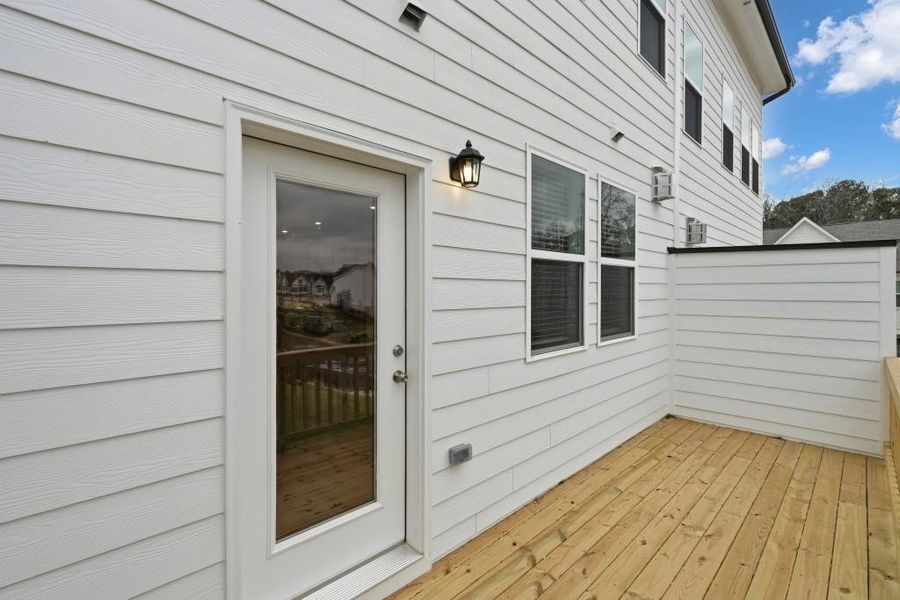 Exterior details and patio area of a home in Towns at Creekside, Doraville (Image 4). Exterior details and patio area of a home in Towns at Creekside, Doraville (Image 4).