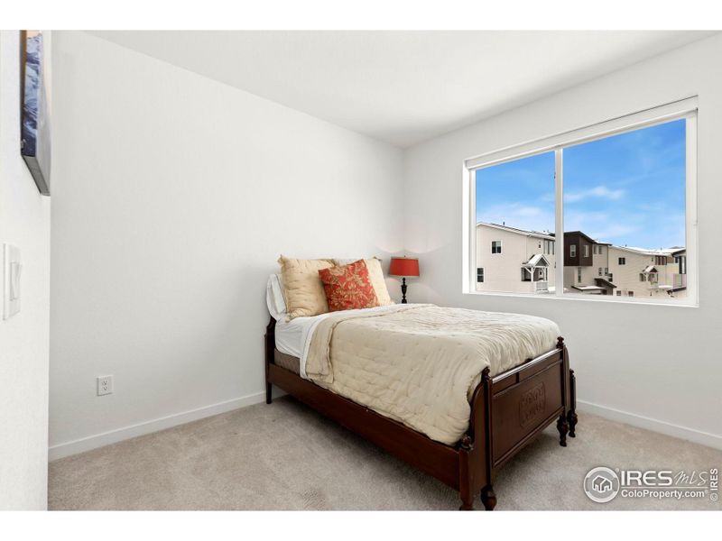 Secondary bedroom with walk-in closet.