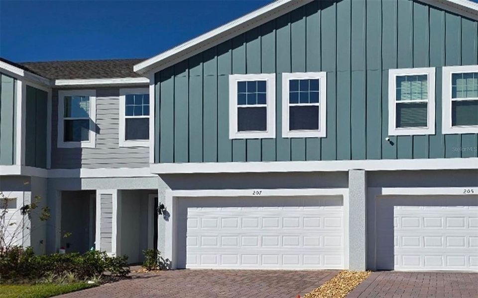 Front exterior of a new home in , Groveland, FL, highlighting curb appeal (Image 1). Front exterior of a new home in , Groveland, FL, highlighting curb appeal (Image 1).