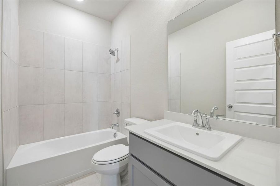 Bathroom in the Emmy II home plan by Trophy Signature Homes - REPRESENTATIVE PHOTO