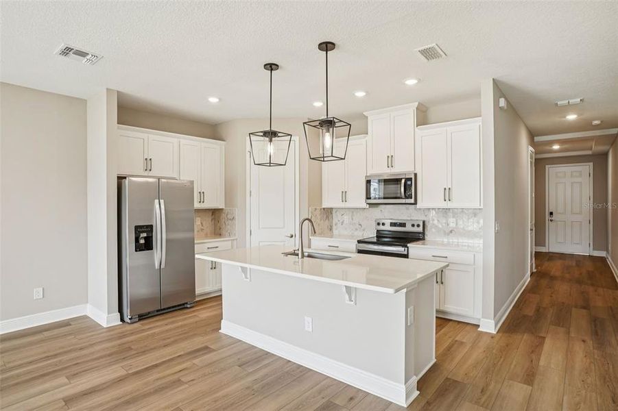 Furnished interior view inside a new home in Legends Preserve - Signature Series, Daytona Beach (Image 6).