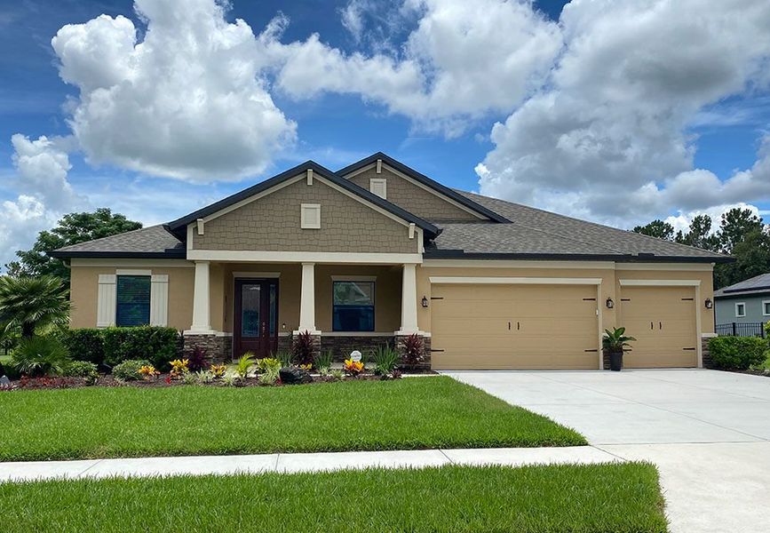 Front exterior of a new home in River Preserve Estates, Parrish, FL, highlighting curb appeal (Image 26).
