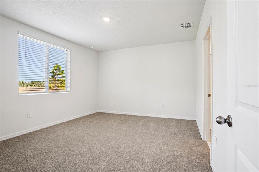 Spacious, unfurnished interior of a new home in Ridgehaven - Villas, Ormond Beach (Image 29).