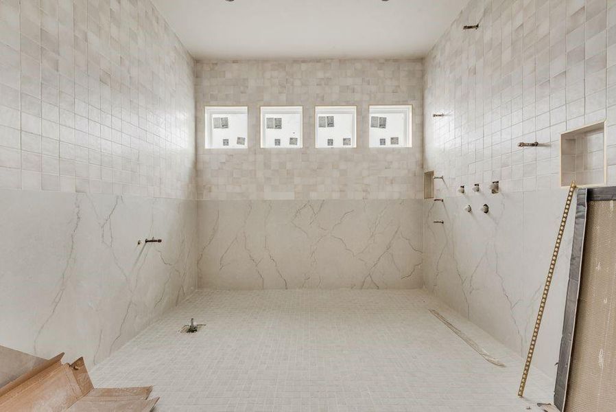 This space will be enclosed in glass & the tub & shower will be enclosed