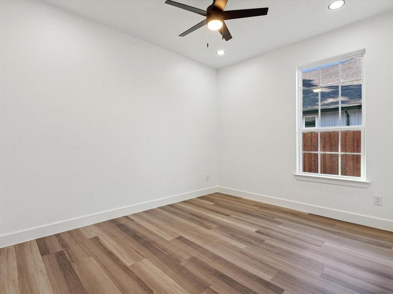 Empty room featuring light hardwood / wood-style floors and ceiling fan