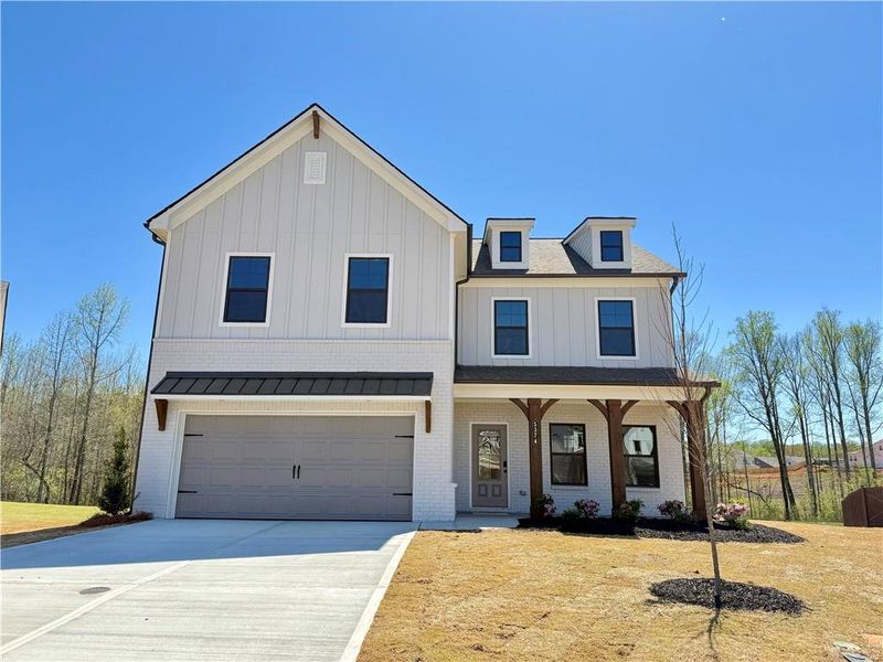 Front exterior of a new home in Ponderosa Farms Estates, Gainesville, GA, highlighting curb appeal (Image 19).