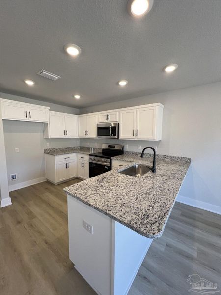 Furnished interior view inside a new home in Allison Acres, Cantonment (Image 7).