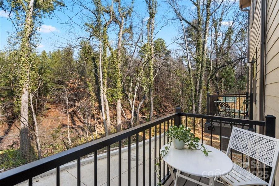 This peaceful balcony with seating for two - does NOT overlook neighboring buildings