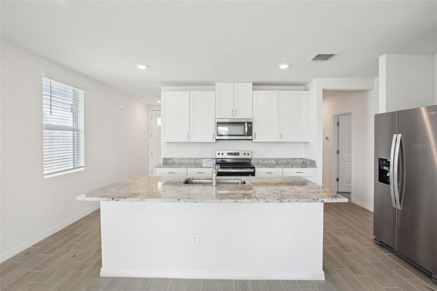 Furnished interior view inside a new home in Benton Hills - Classic Series, Brooksville (Image 7). Furnished interior view inside a new home in Benton Hills - Classic Series, Brooksville (Image 7).