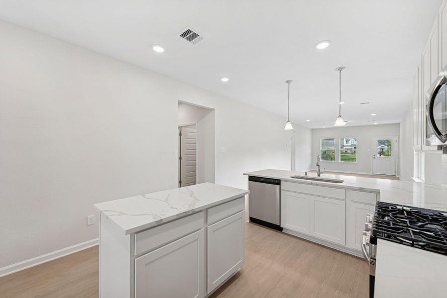 The Cardinal II- Kitchen. Photos of home shown are for illustration only; actual features, colors, and upgrades may vary. The Cardinal II- Kitchen. Photos of home shown are for illustration only; actual features, colors, and upgrades may vary.