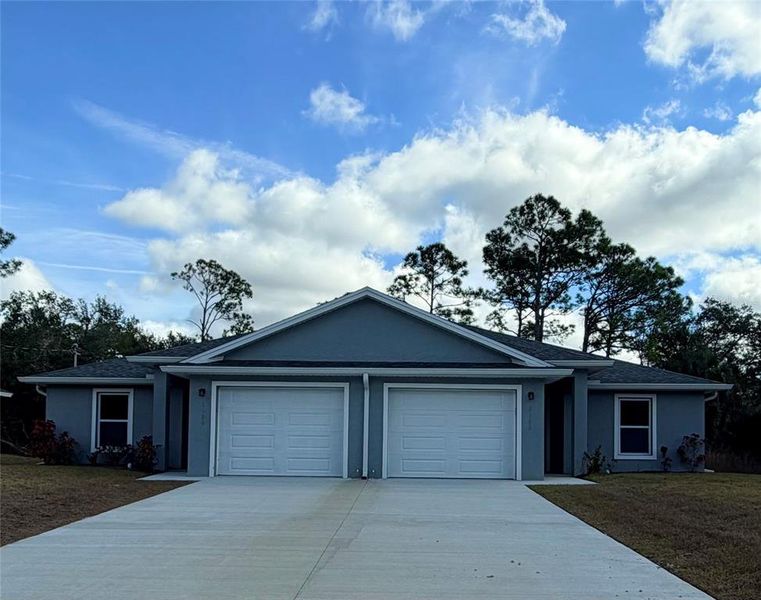 Front exterior of a new home in , Port Charlotte, FL, highlighting curb appeal (Image 1). Front exterior of a new home in , Port Charlotte, FL, highlighting curb appeal (Image 1).