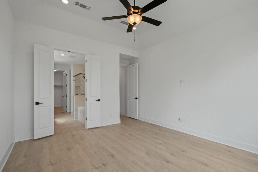 Primary Bedroom with elevated ceiling Primary Bedroom with elevated ceiling