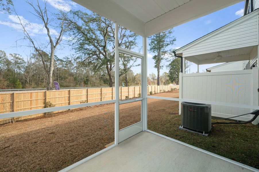 Exterior details and patio area of a home in Windward Townes, Goose Creek (Image 2).