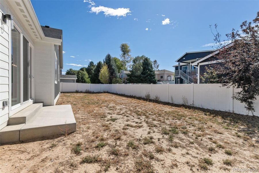 Backyard is fenced on 3 sides.