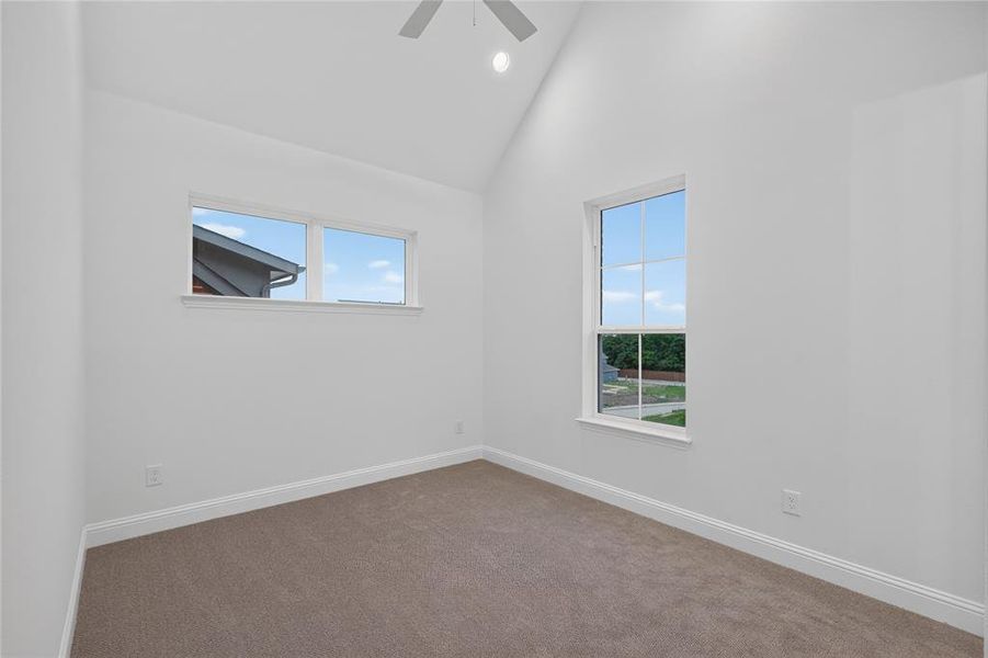 Vaulted ceiling room with two distinct window styles Vaulted ceiling room with two distinct window styles