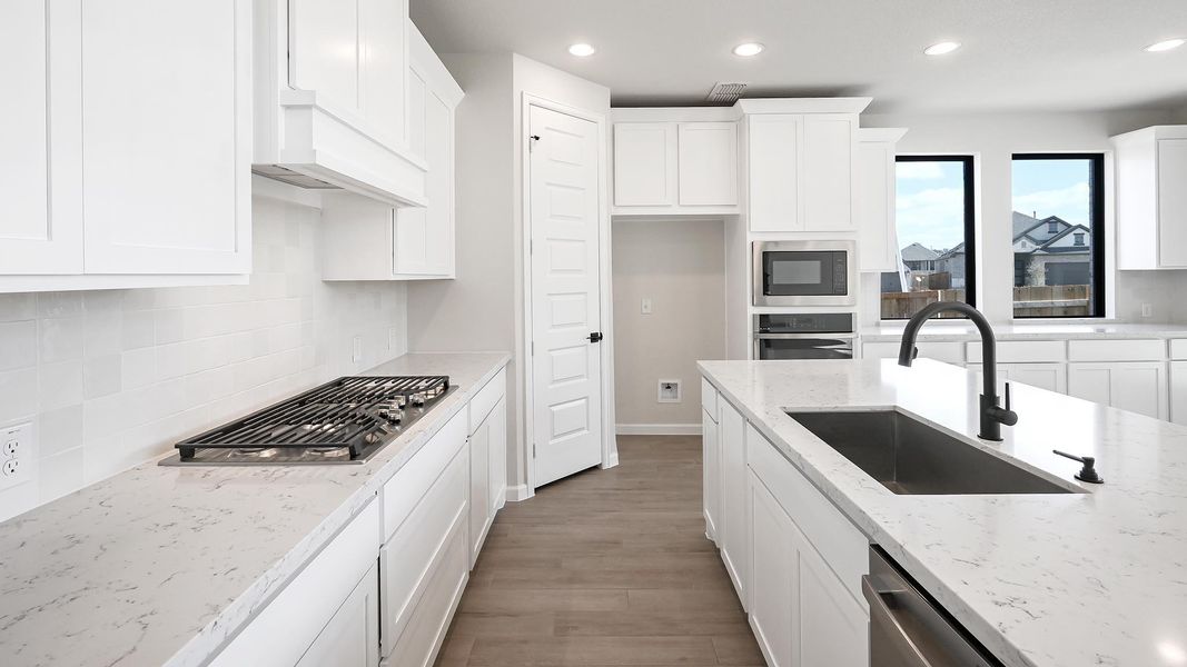 Furnished interior view inside a new home in 6 Creeks, Kyle (Image 11).