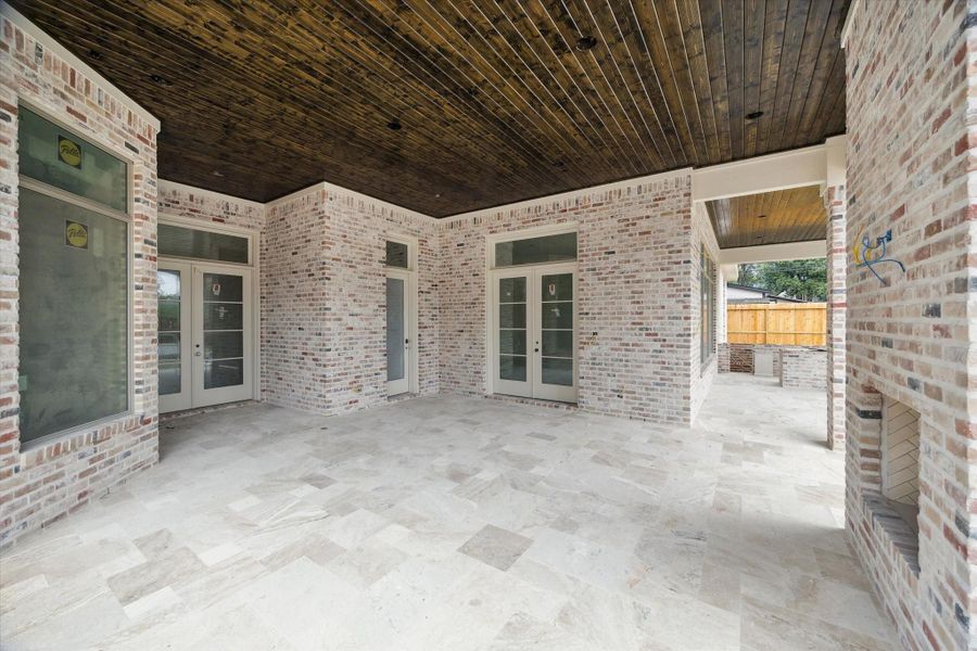 Progress photo from December 2025 - covered patio with outdoor kitchen