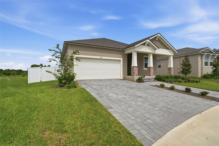 Front exterior of a new home in , Clermont, FL, highlighting curb appeal (Image 25).