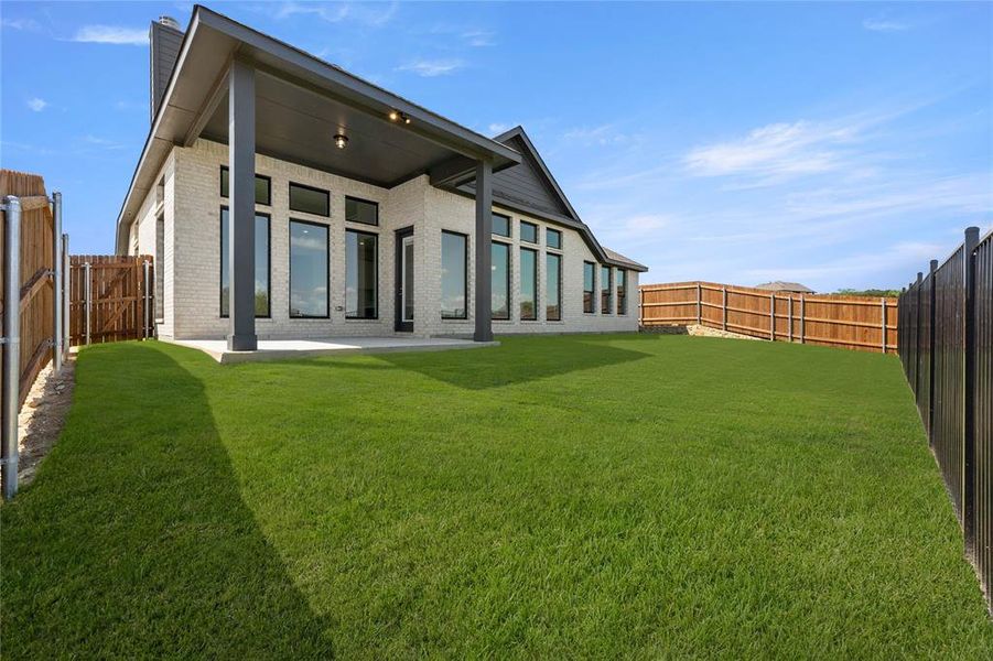 Exterior details and patio area of a home in The Parks at Panchasarp Farms - Phase 3, Burleson (Image 4). Exterior details and patio area of a home in The Parks at Panchasarp Farms - Phase 3, Burleson (Image 4).