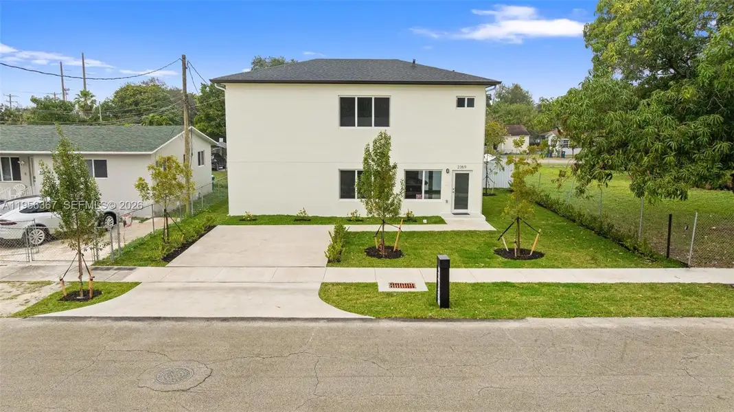 Front exterior of a new home in , Miami, FL, highlighting curb appeal (Image 1). Front exterior of a new home in , Miami, FL, highlighting curb appeal (Image 1).