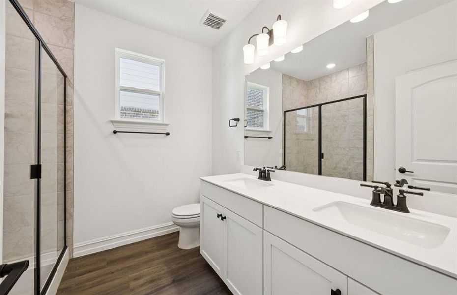 Stylish secondary bath with high-end fixtures *Real home pictured Stylish secondary bath with high-end fixtures *Real home pictured