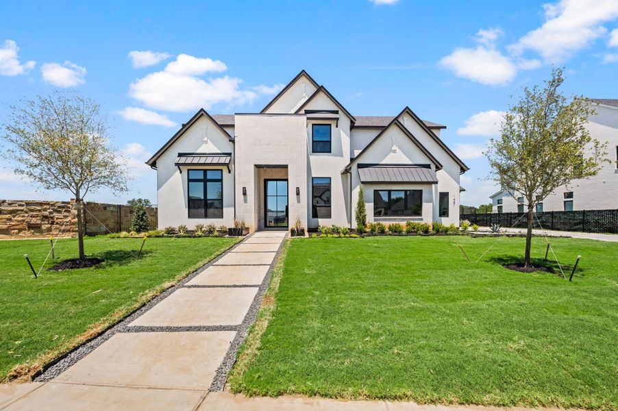 Front exterior of a new home in Montclair, Prosper, TX, highlighting curb appeal (Image 1). Front exterior of a new home in Montclair, Prosper, TX, highlighting curb appeal (Image 1).