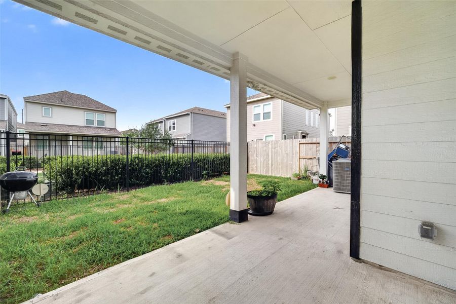 Exterior details and patio area of a home in McClendon Park Village, Houston (Image 25).