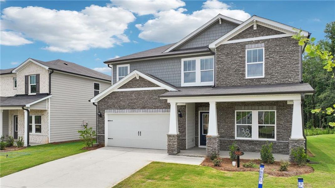 Front exterior of a new home in Vines at Mill Creek - Estate Series, Braselton, GA, highlighting curb appeal (Image 2).