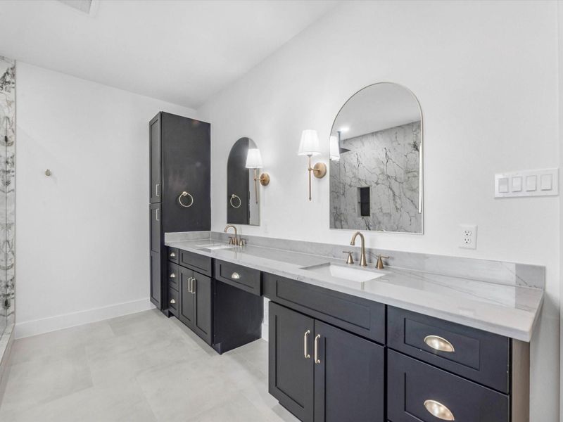 This bathroom has it all! Double sinks with plenty of countertop space. You have extra cabinets to maximize your storage.