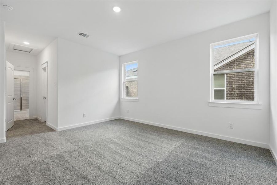 Unfurnished bedroom featuring carpet and recessed lighting