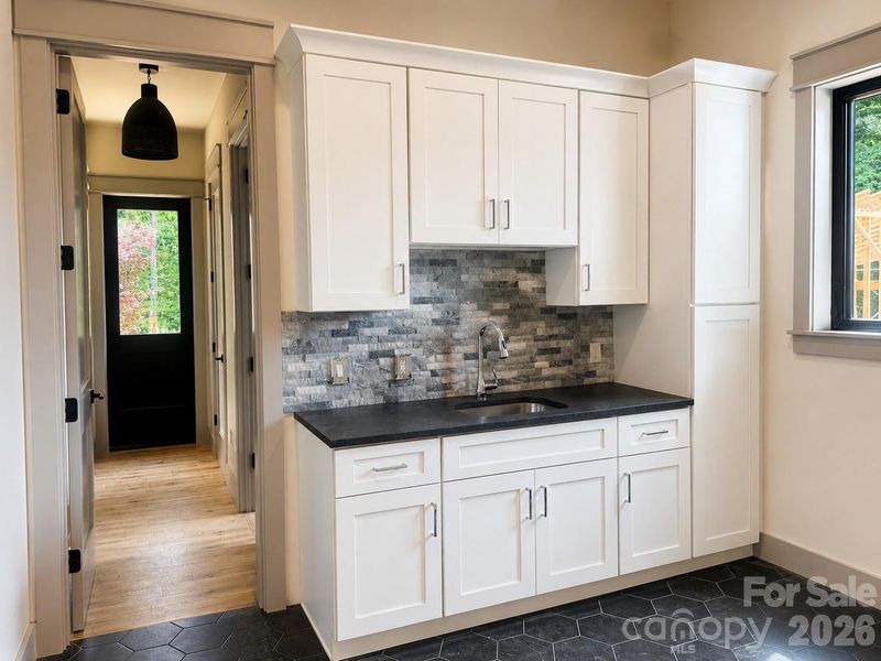 Functional mudroom and laundry area with built-in cabinetry