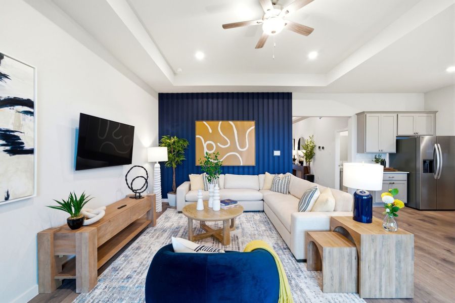 A living room with a couch and a table. A living room with a couch and a table.