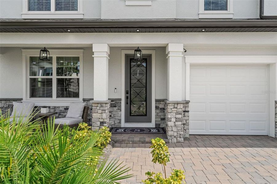 Front exterior of a new home in Whispering Oaks Preserve, Wesley Chapel, FL, highlighting curb appeal (Image 25).