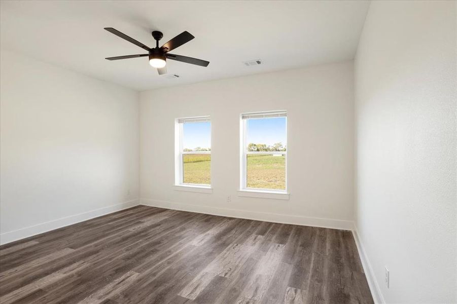 Master room featuring  wood-style flooring and a ceiling fan