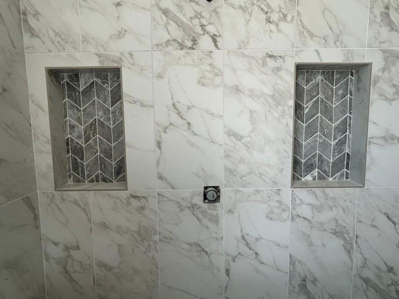 Bathroom view of a tile shower