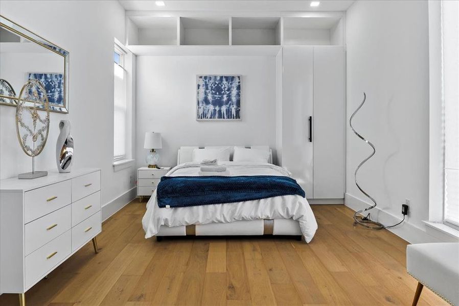 Bedroom featuring picture window and multiple cubbies