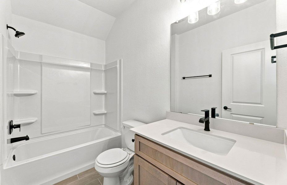 Furnished interior view inside a new home in West Cypress Hills, Spicewood (Image 9).