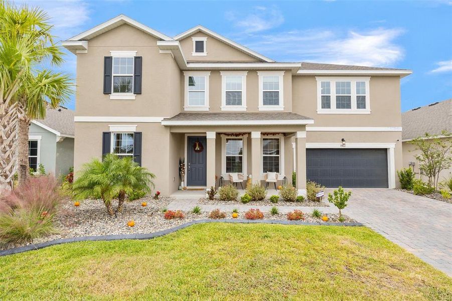 Front exterior of a new home in Seaire, Parrish, FL, highlighting curb appeal (Image 25).