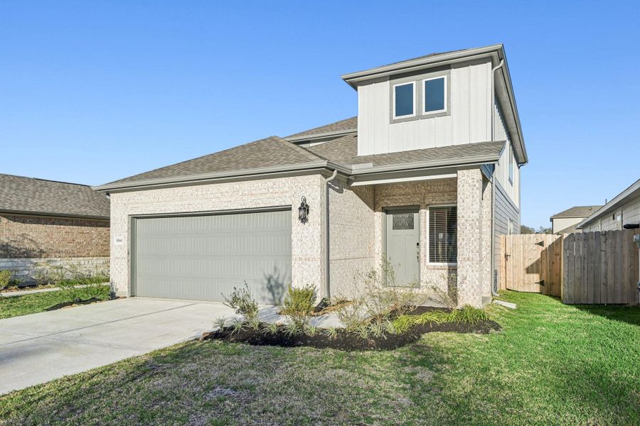Front exterior of a new home in Landing Meadows - Traditional Series, New Caney, TX, highlighting curb appeal (Image 23). Front exterior of a new home in Landing Meadows - Traditional Series, New Caney, TX, highlighting curb appeal (Image 23).