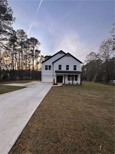 Front exterior of a new home in , Covington, GA, highlighting curb appeal (Image 2). Front exterior of a new home in , Covington, GA, highlighting curb appeal (Image 2).
