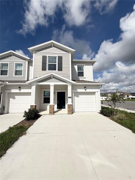 Front exterior of a new home in , Davenport, FL, highlighting curb appeal (Image 1). Front exterior of a new home in , Davenport, FL, highlighting curb appeal (Image 1).
